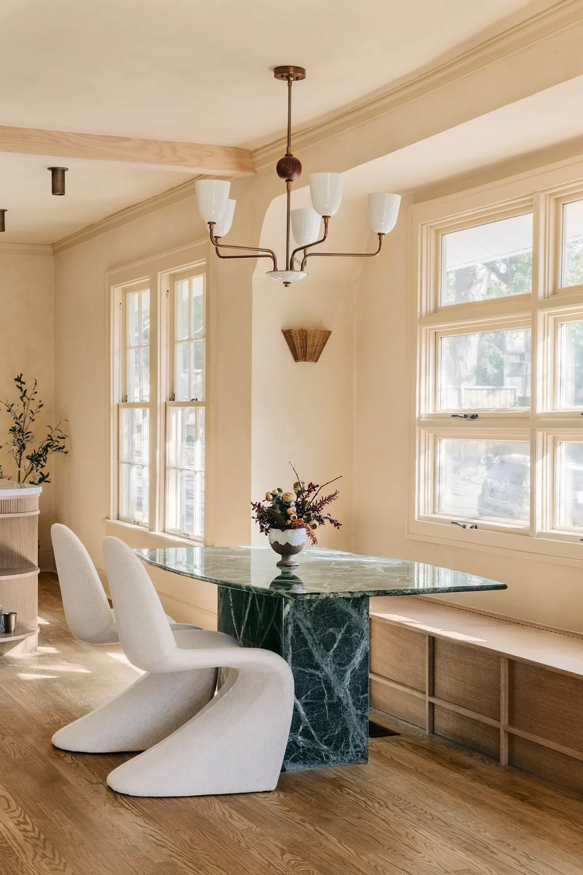 Dining room with a marble table and sculptural chairs